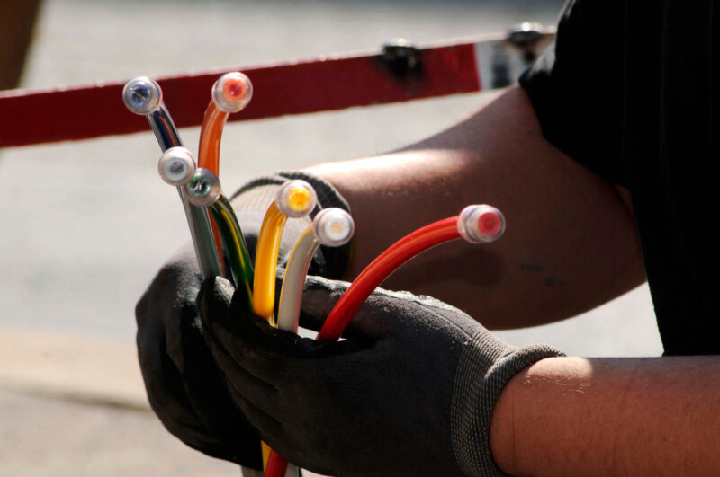 technician with fiber optic cables 